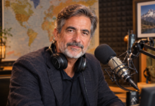 Paco Grande Spanish radio journalist hosting Tiempo de Aventura on RNE in a broadcasting studio